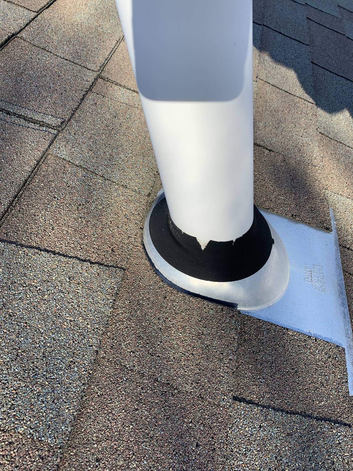 Cracked roof pipe boot found during a leak inspection by David Deschaine Roofing in Maine